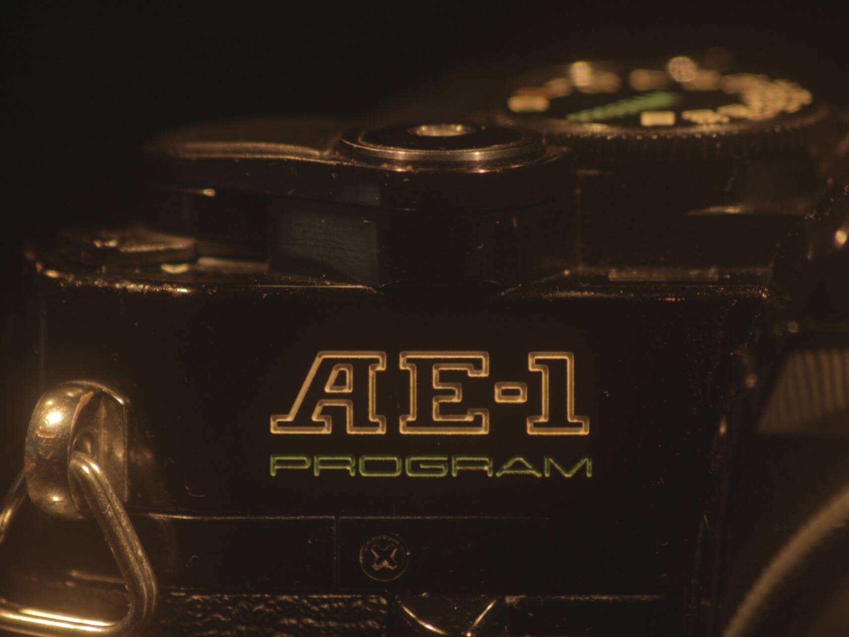 Canon AE-1 Program film camera, close-up photo of the AE-1 badge